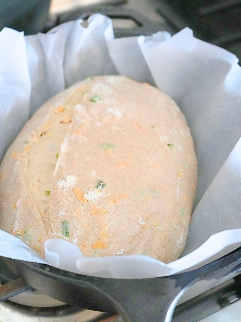 Dough placed in a Dutch oven, ready for baking