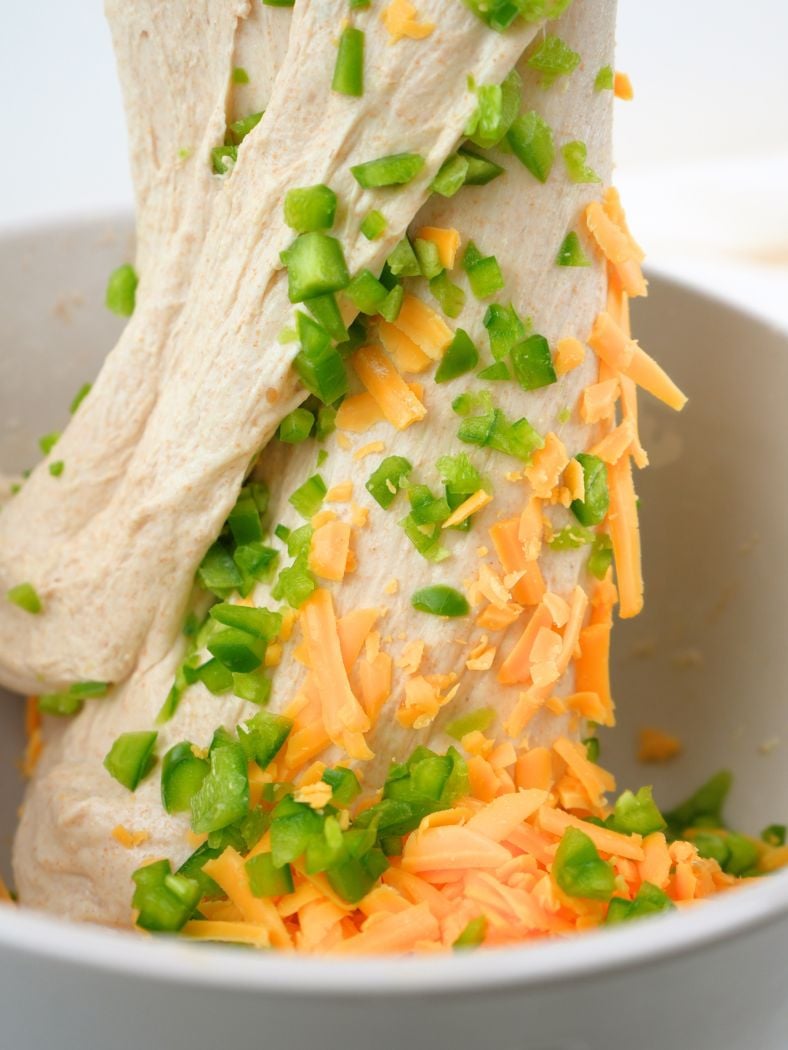 A stretch and fold showing how jalapeños and cheese mix into the dough