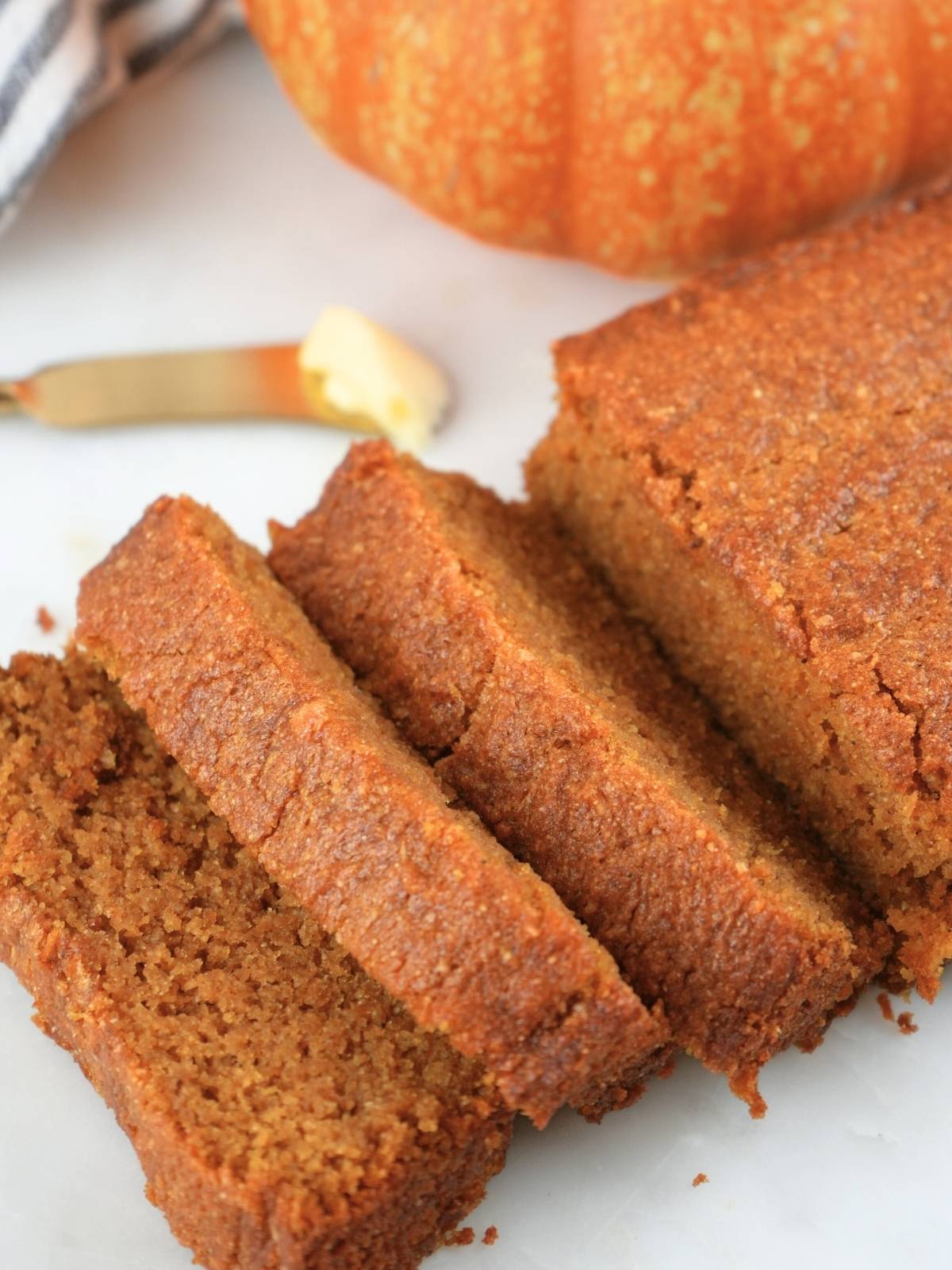 A loaf of fresh-milled pumpkin bread, sliced.