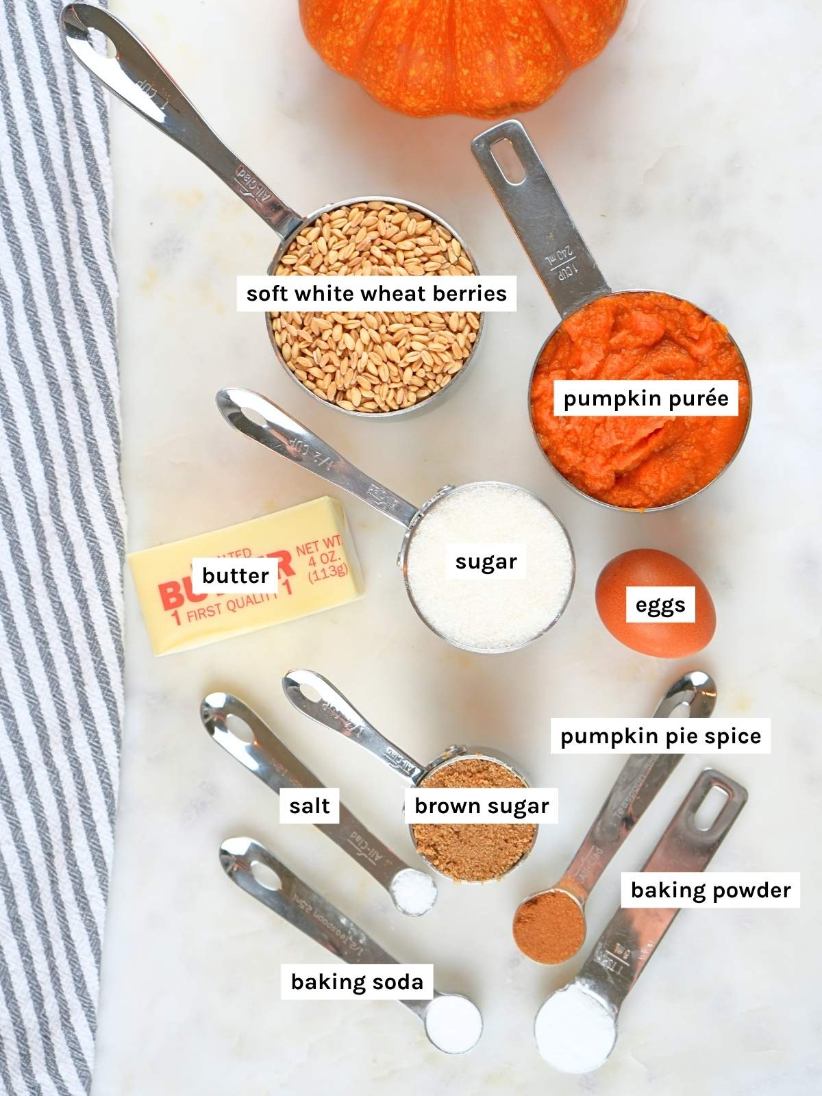 Fresh-milled pumpkin bread ingredients displayed and labeled.