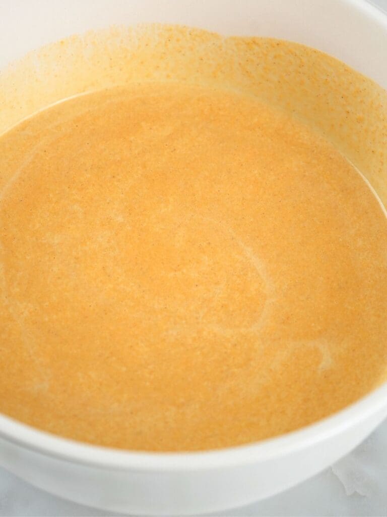 Pumpkin ice cream base in a bowl.