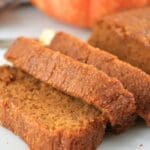 A loaf of fresh-milled pumpkin bread sliced.