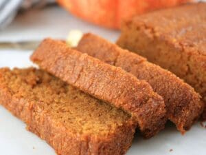 A loaf of fresh-milled pumpkin bread sliced.