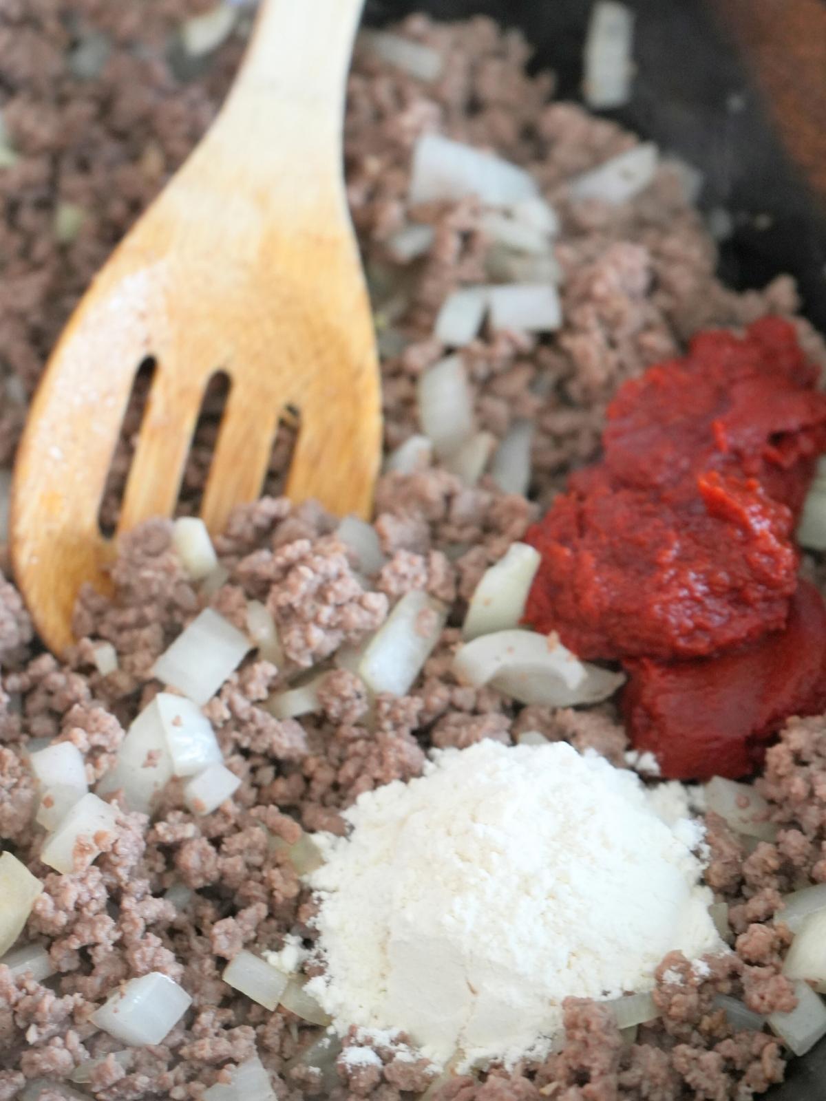 Ground beef mixture with flour and tomato paste.