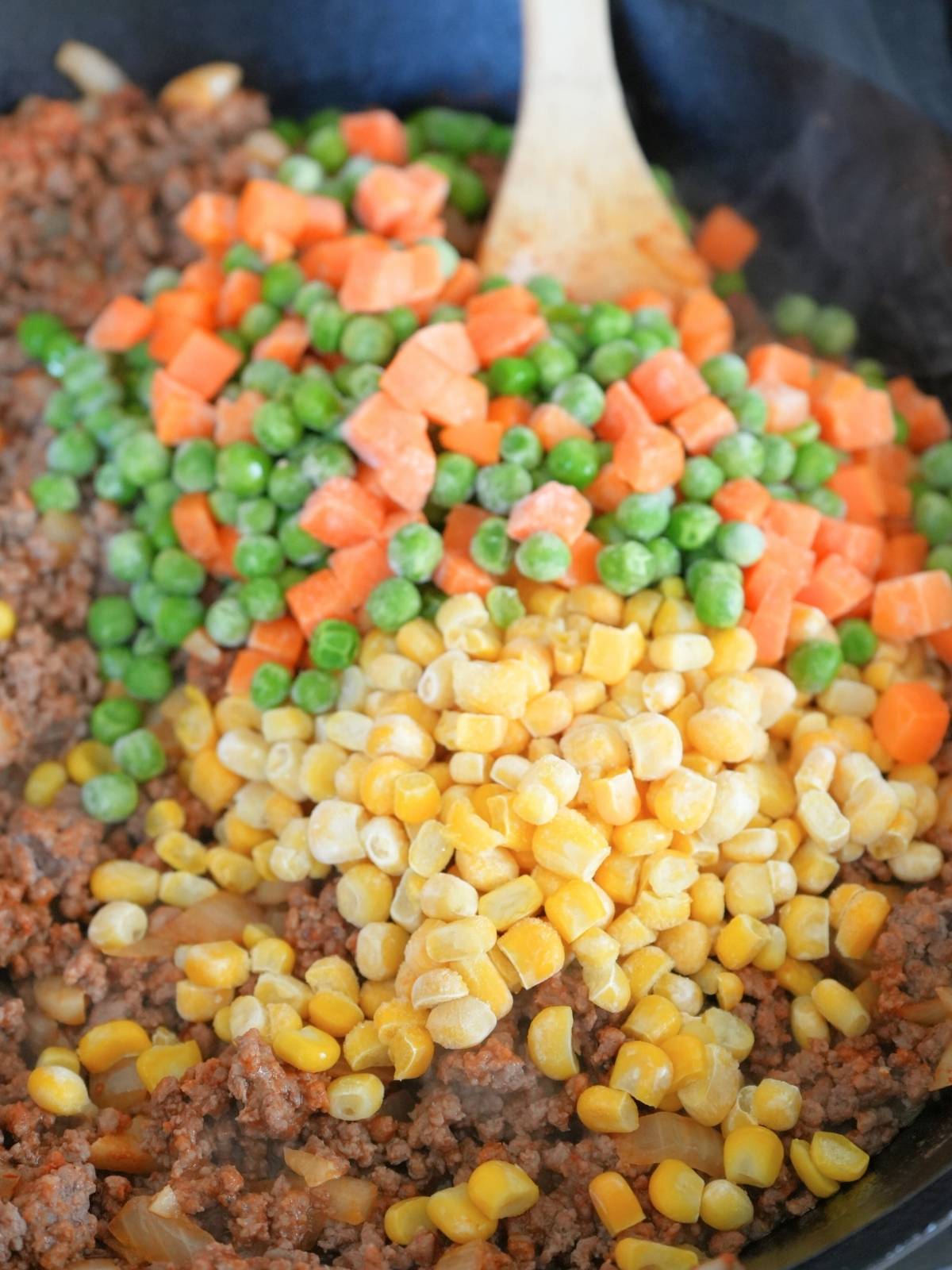 Shepherd's Pie ground beef mixture with frozen veggies.