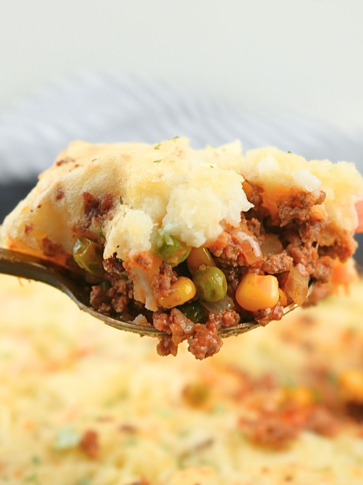 A scoop of shepherd's pie on a spoon.