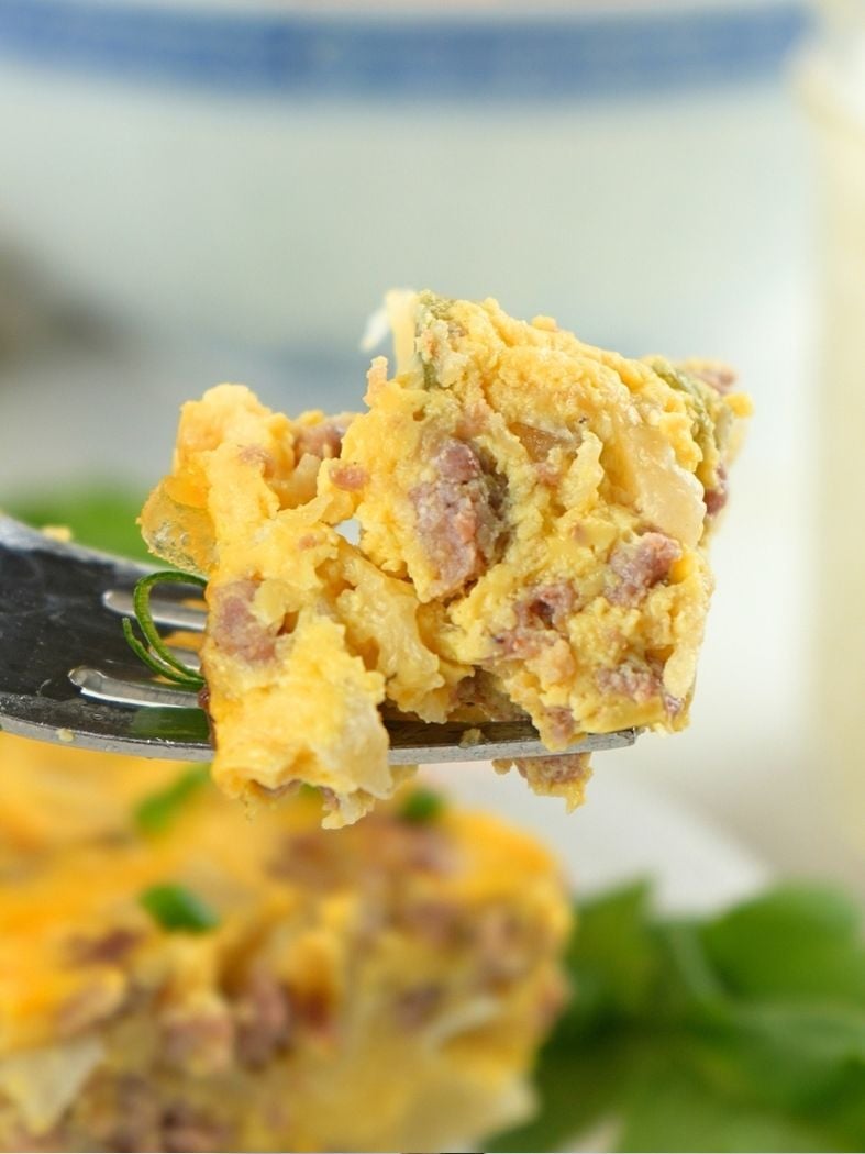 A close up of a forkful of slow cooker breakfast casserole