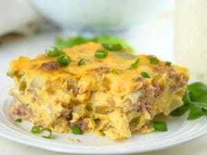 A slice of slow cooker breakfast casserole on a small dish.