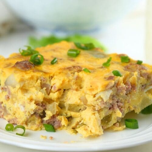 A slice of slow cooker breakfast casserole on a small dish.