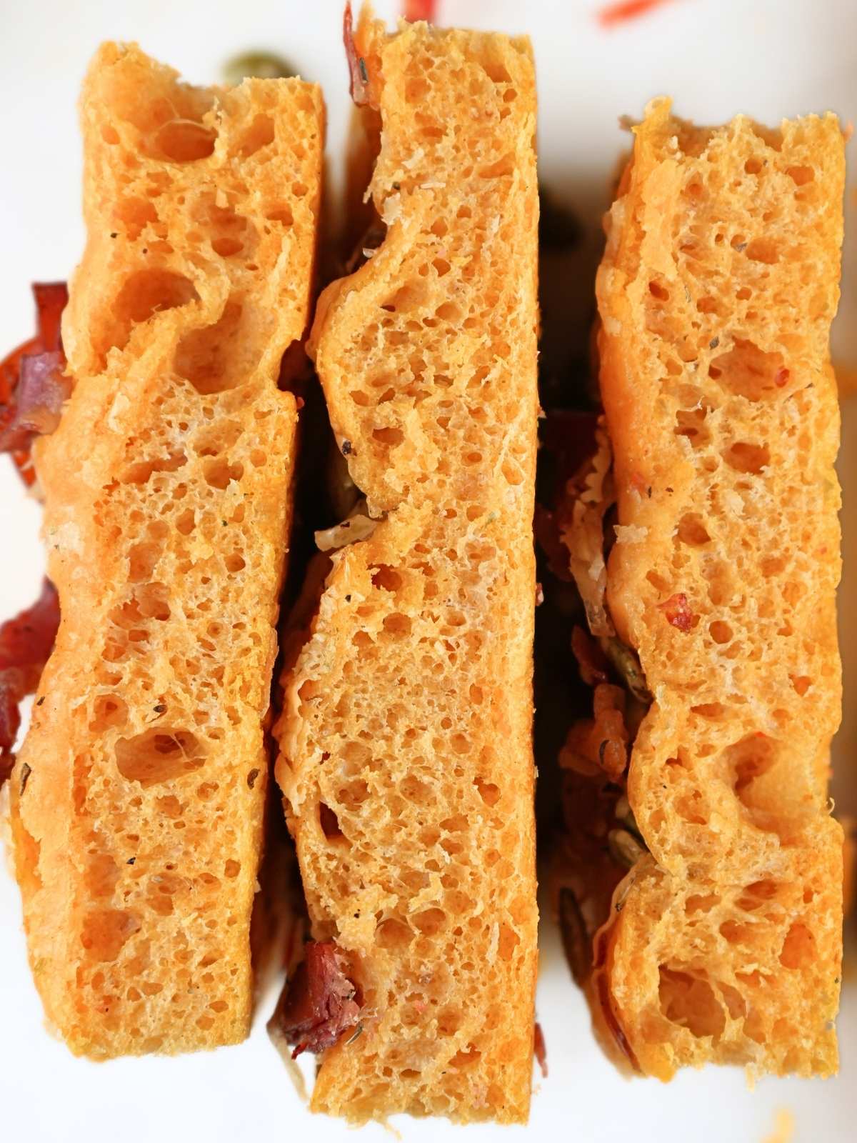 Stacked slices of sourdough pumpkin focaccia.