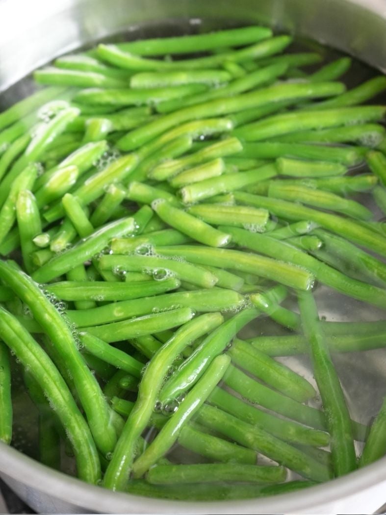 Green beans in a pot of boiling water