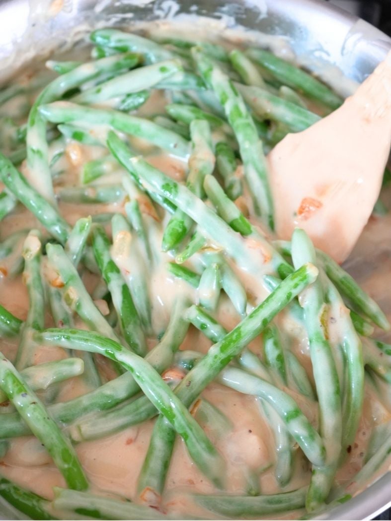 Green beans tossed in a creamy caramelized onion sauce