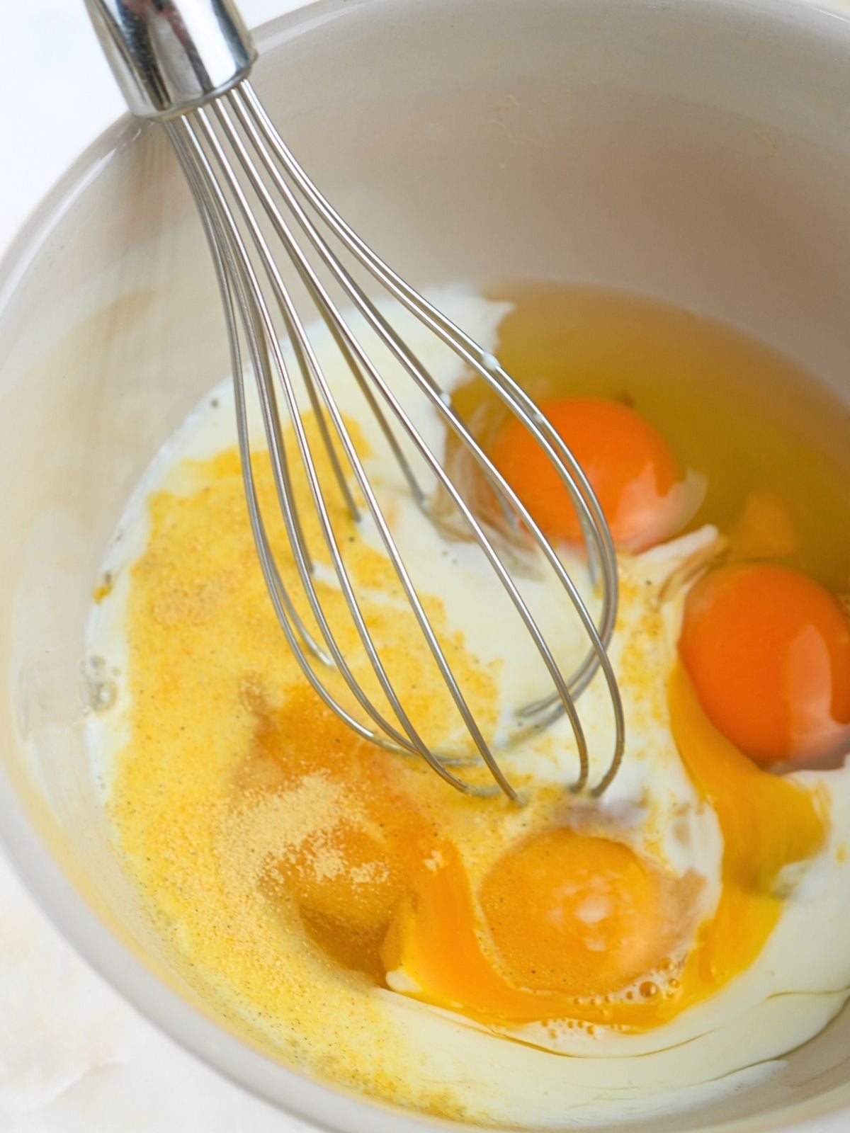 Milk and seasoning in egg mixture.