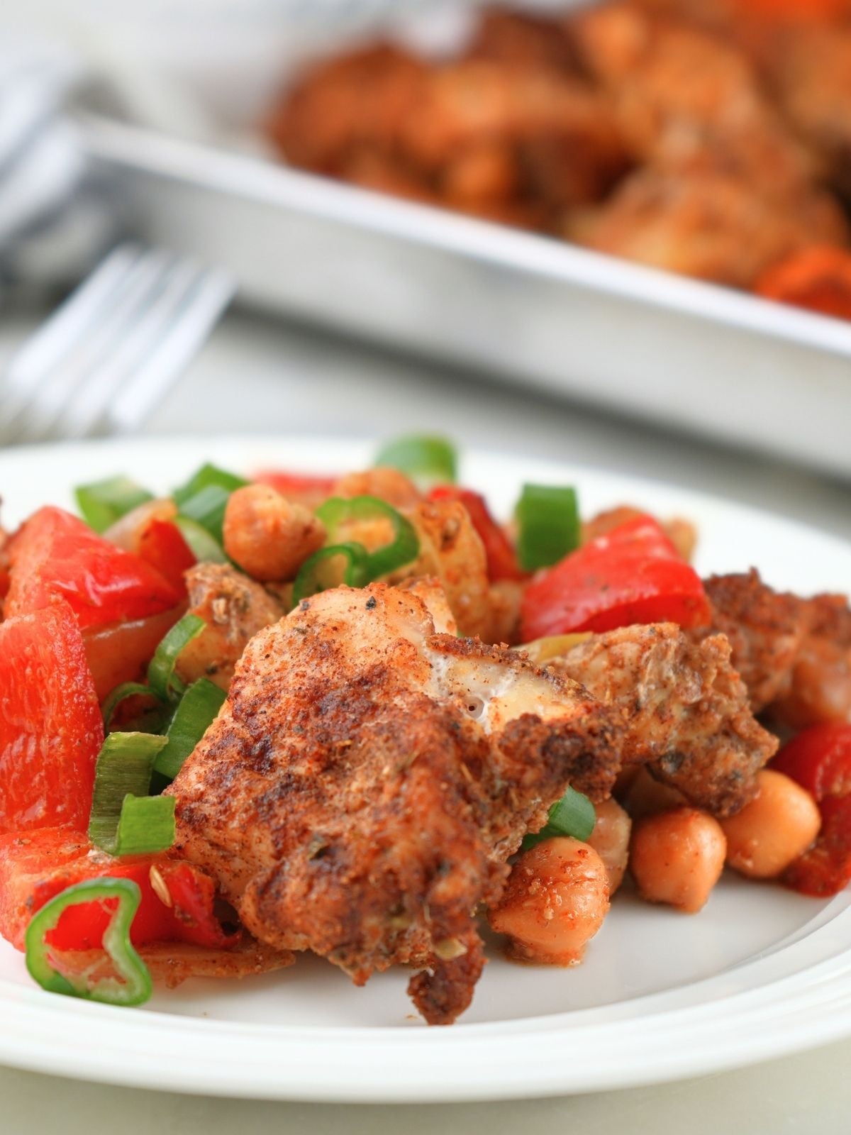 Chicken shawarma sheet pan dinner on a dinner plate.