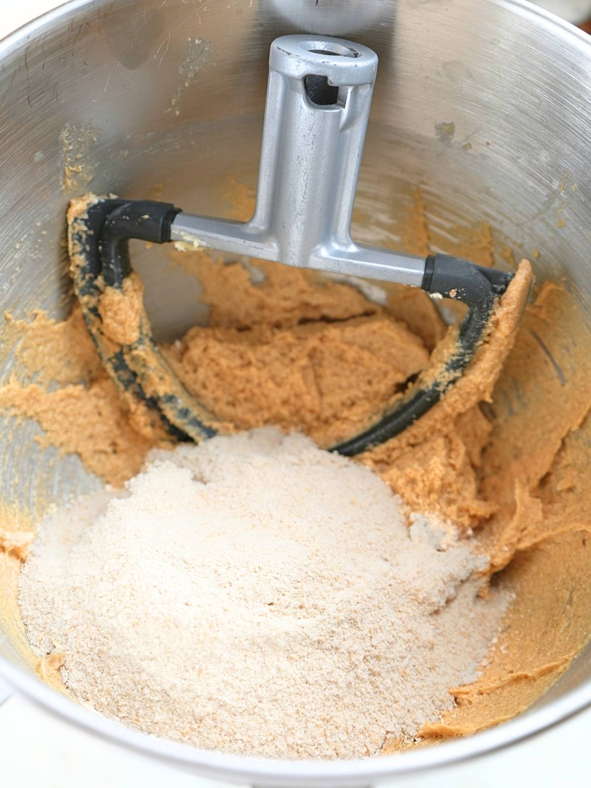 Dry ingredients in bowl with wet ingredients.