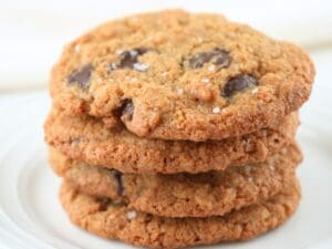 Fresh-milled chocolate chip cookies on a plate.