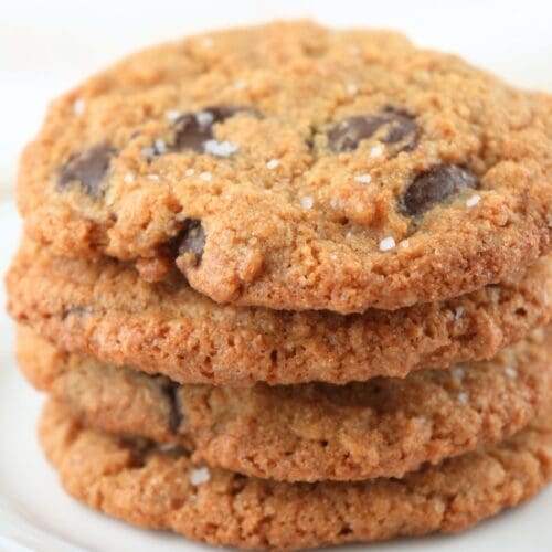Fresh-milled chocolate chip cookies on a plate.