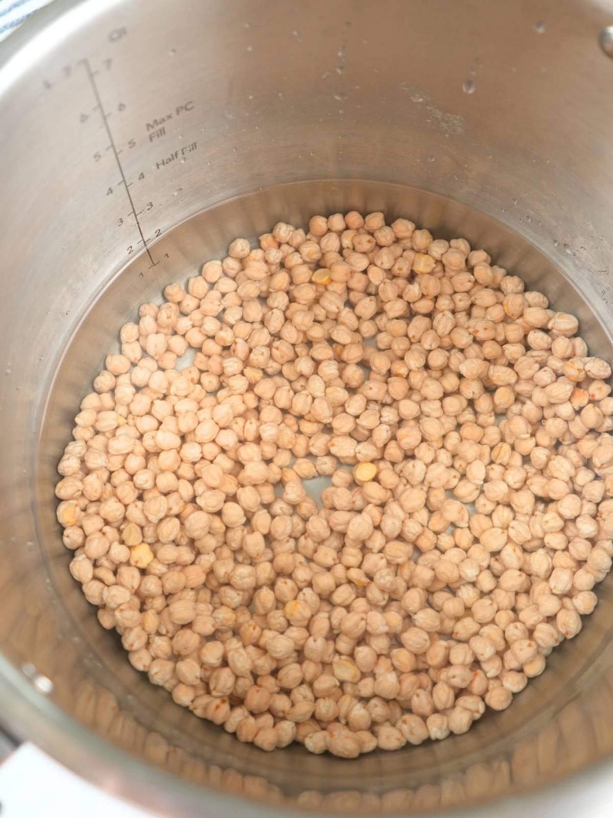 Dry chickpeas and water in an Instant Pot.