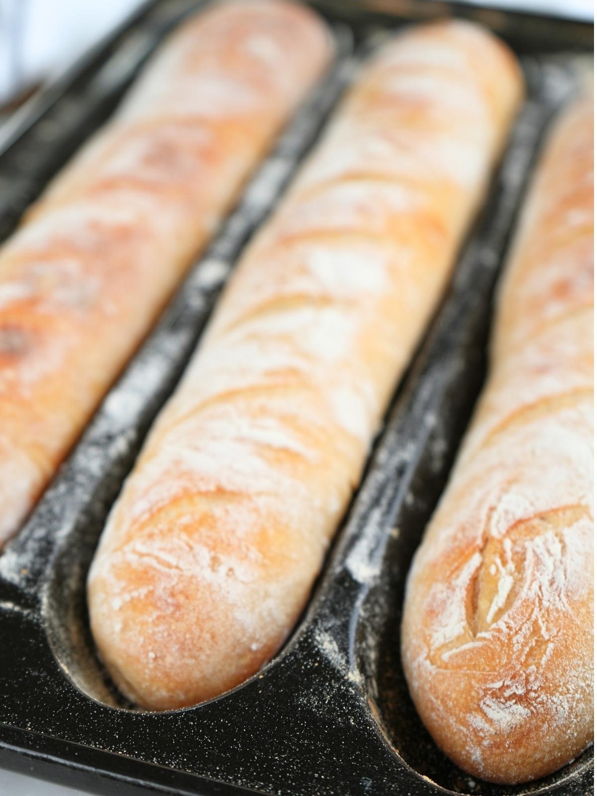 Baked baguettes in a pan.