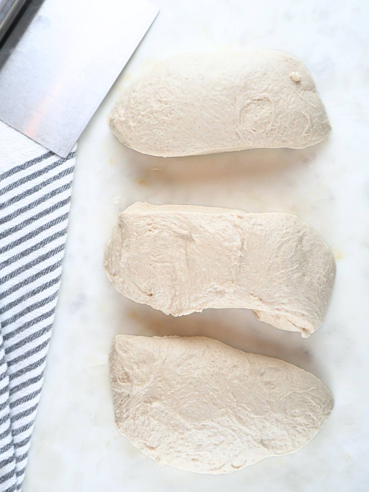 Dough divided into three portions.