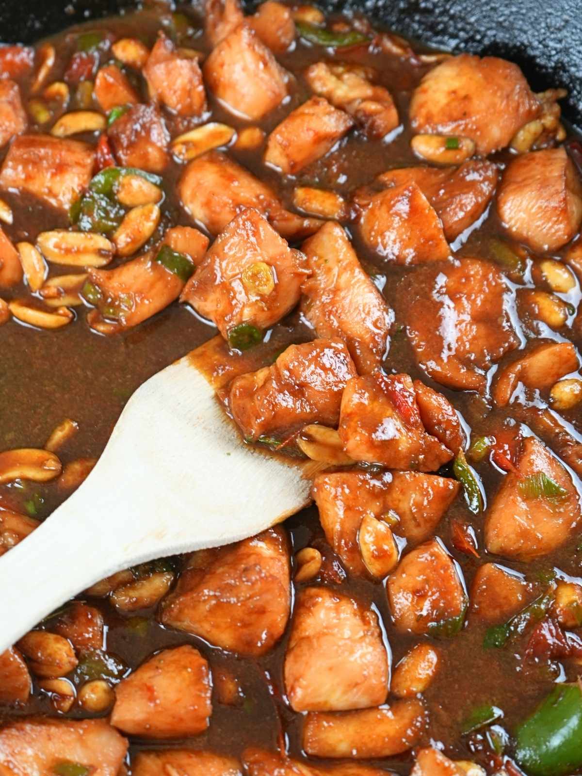 Finished kung pao chicken in a skillet.
