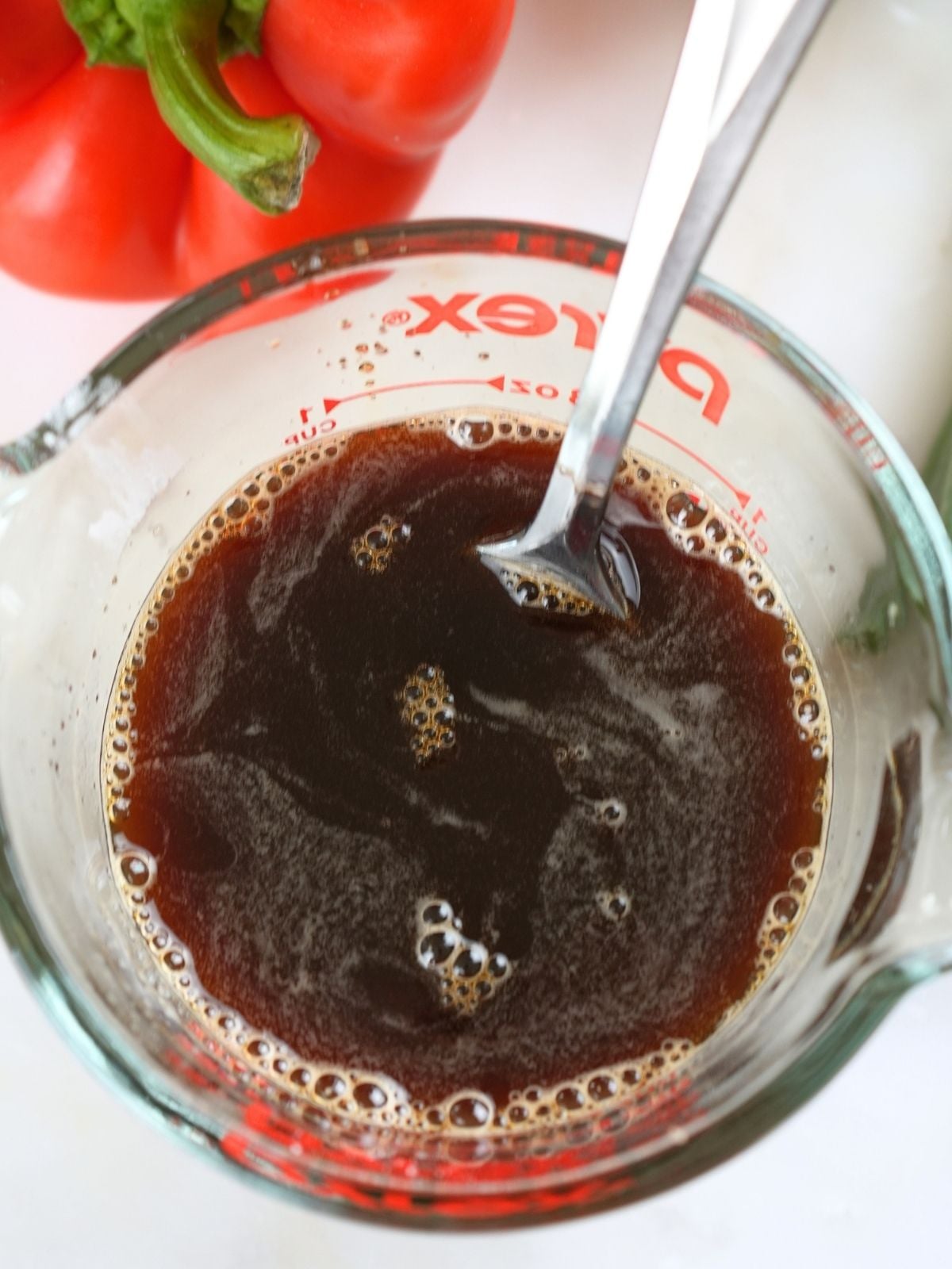 Kung pao chicken sauce in a measuring cup.