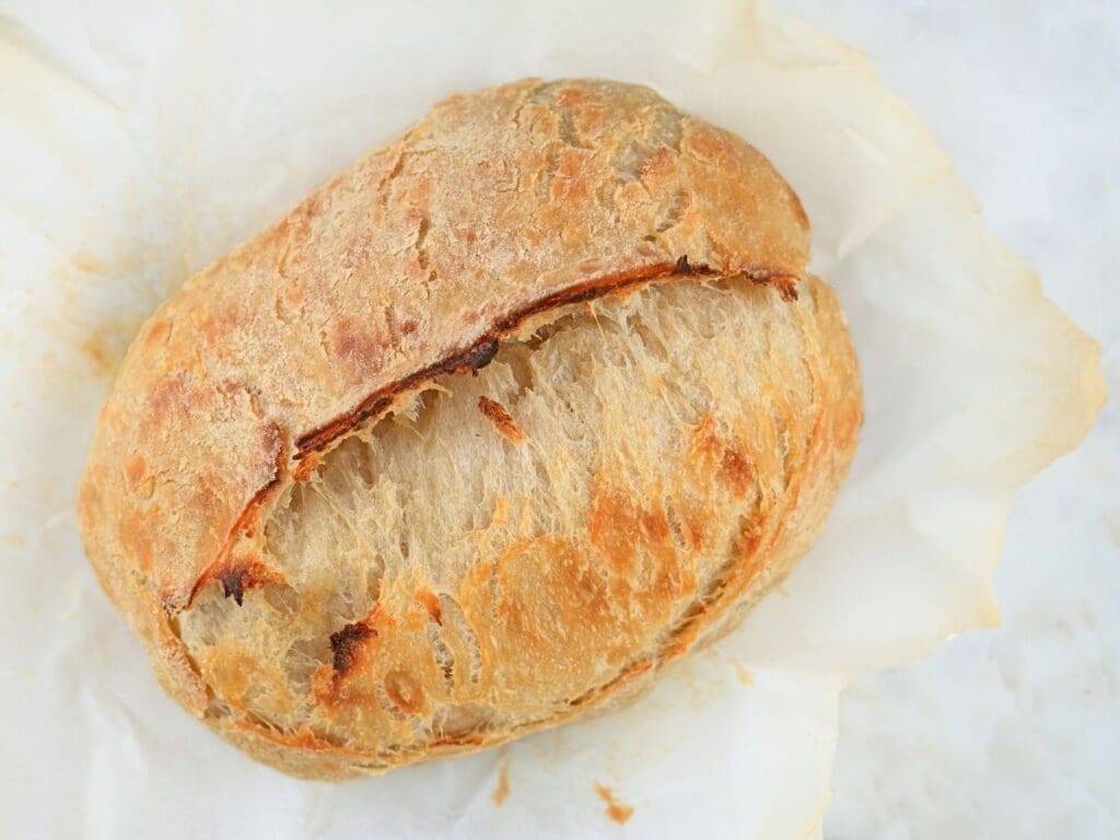 Sourdough croissant bread on parchment paper.