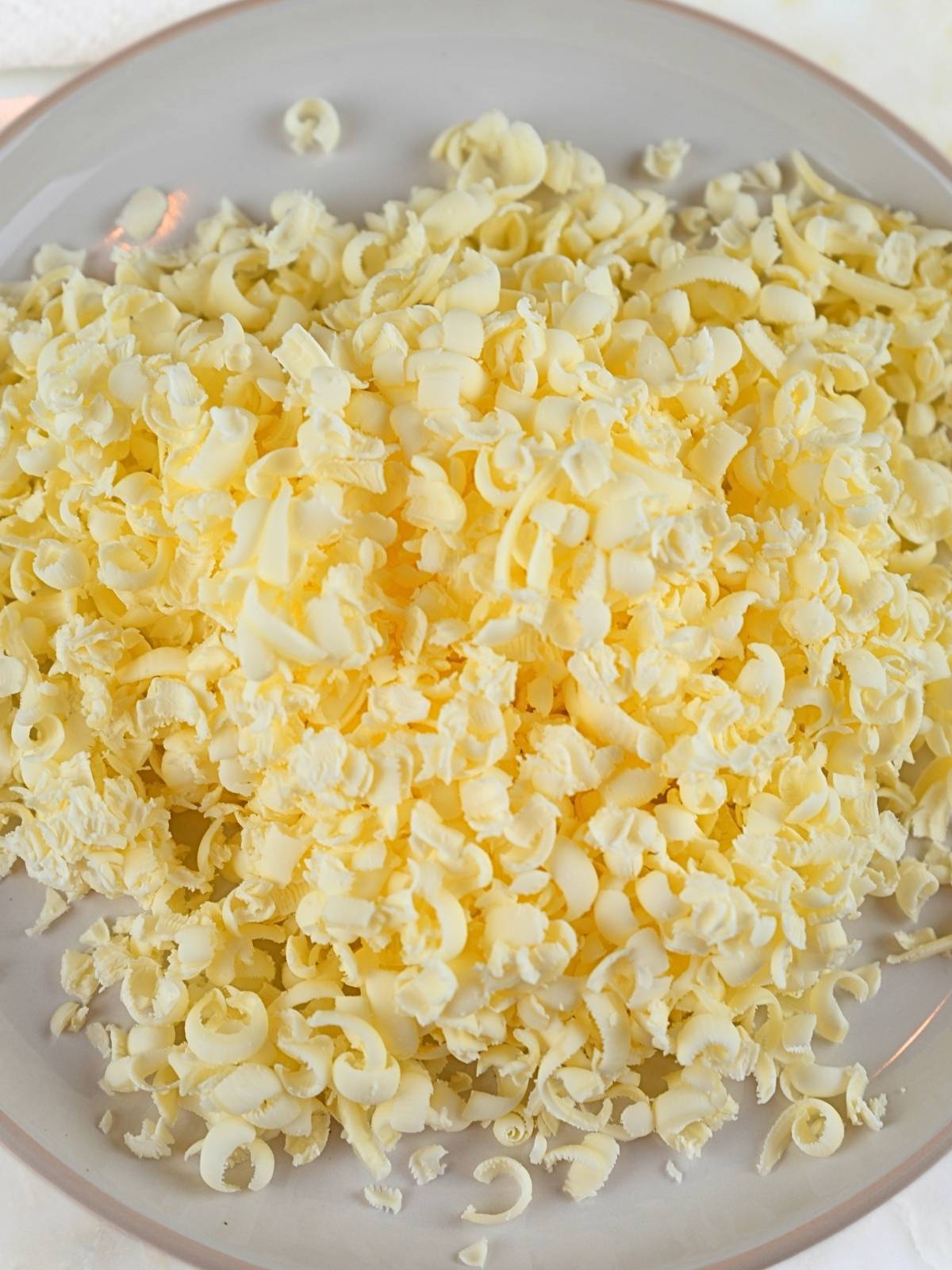 Frozen, shredded butter on a plate.