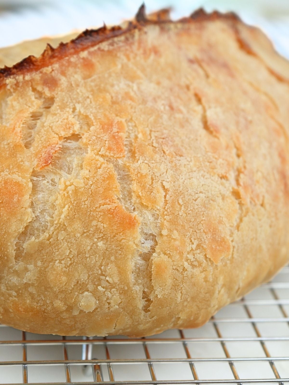 Sourdough croissant bread on a cooling rack.