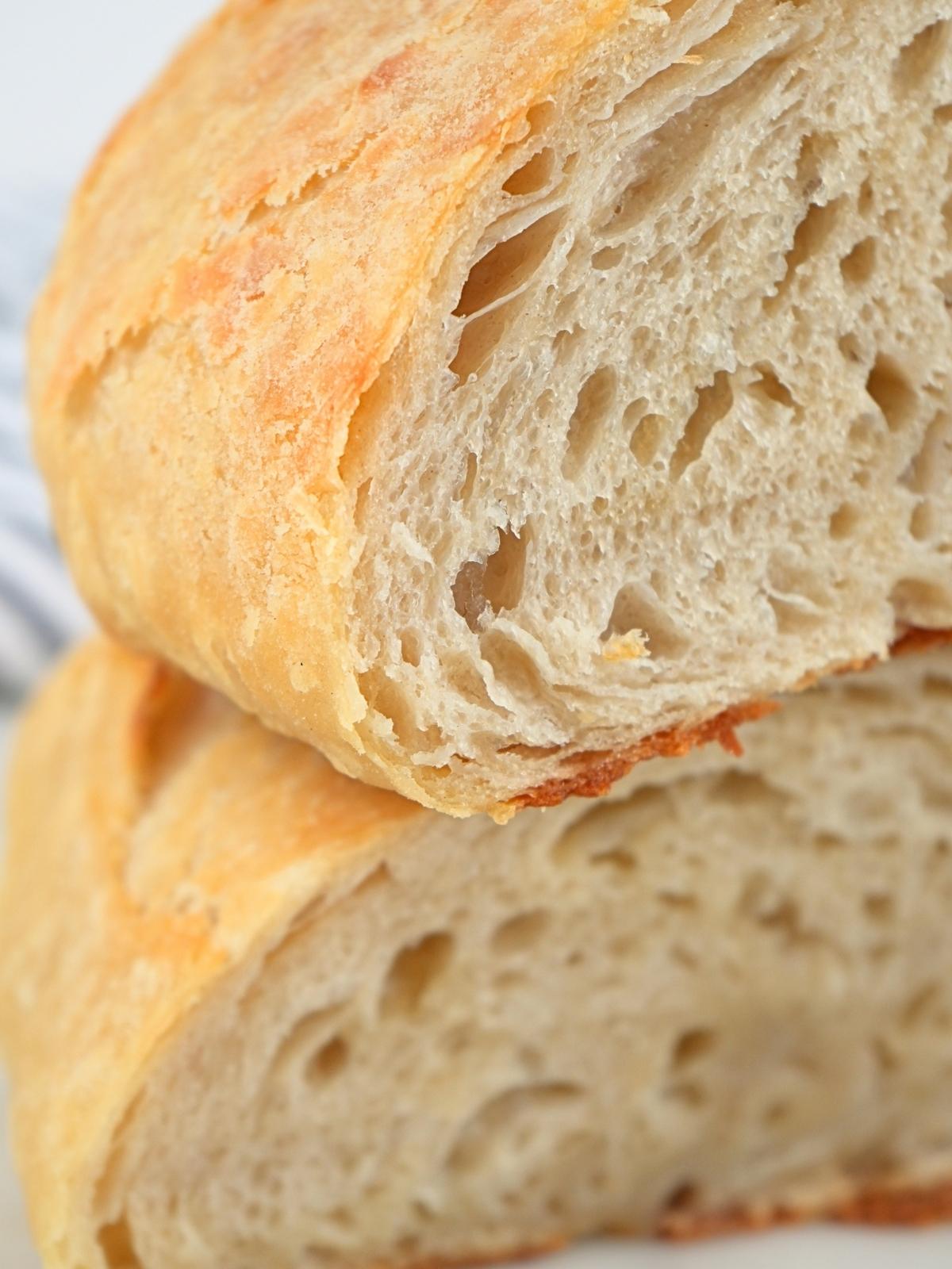 A stack of sliced sourdough croissant bread.