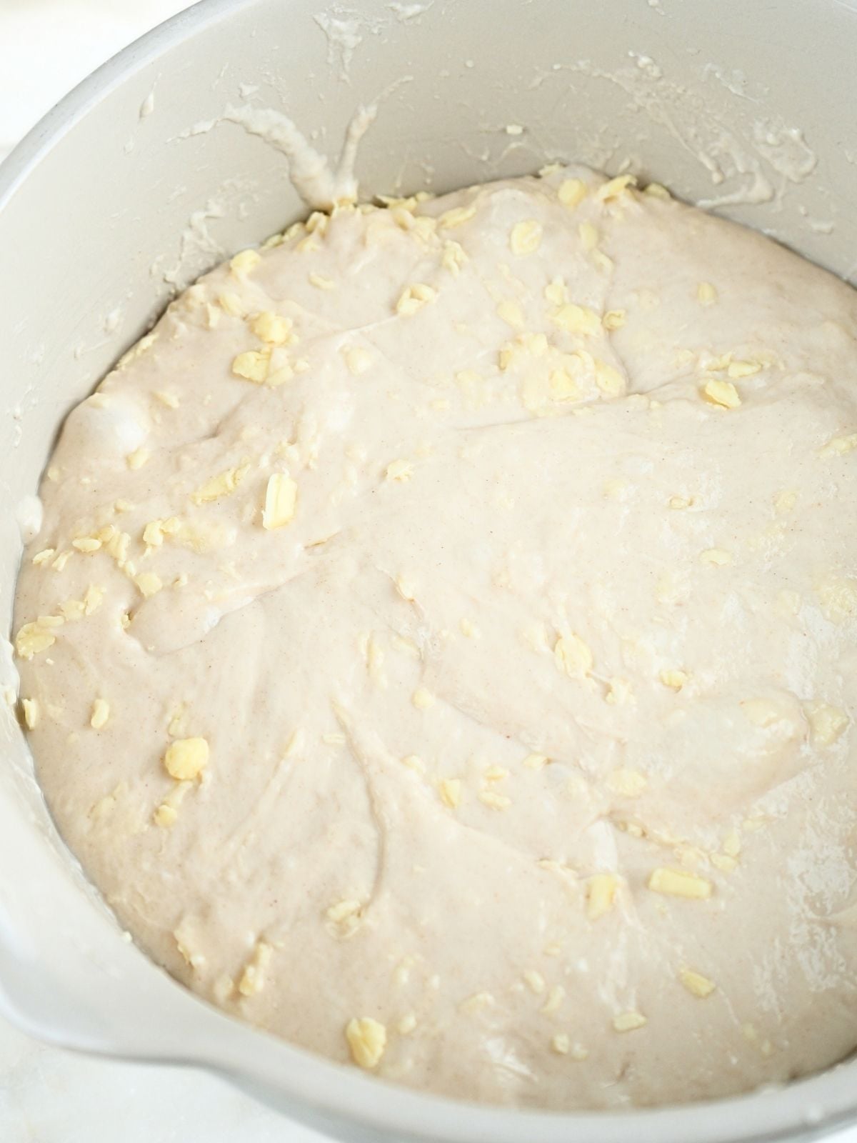 Sourdough croissant bread dough in a bowl after bulk fermenting.