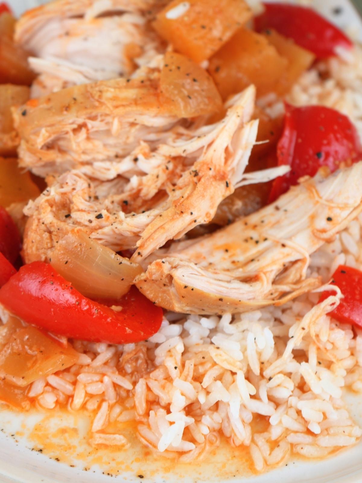 Sweet and sour chicken freezer meal cooked and on a bed of white rice.