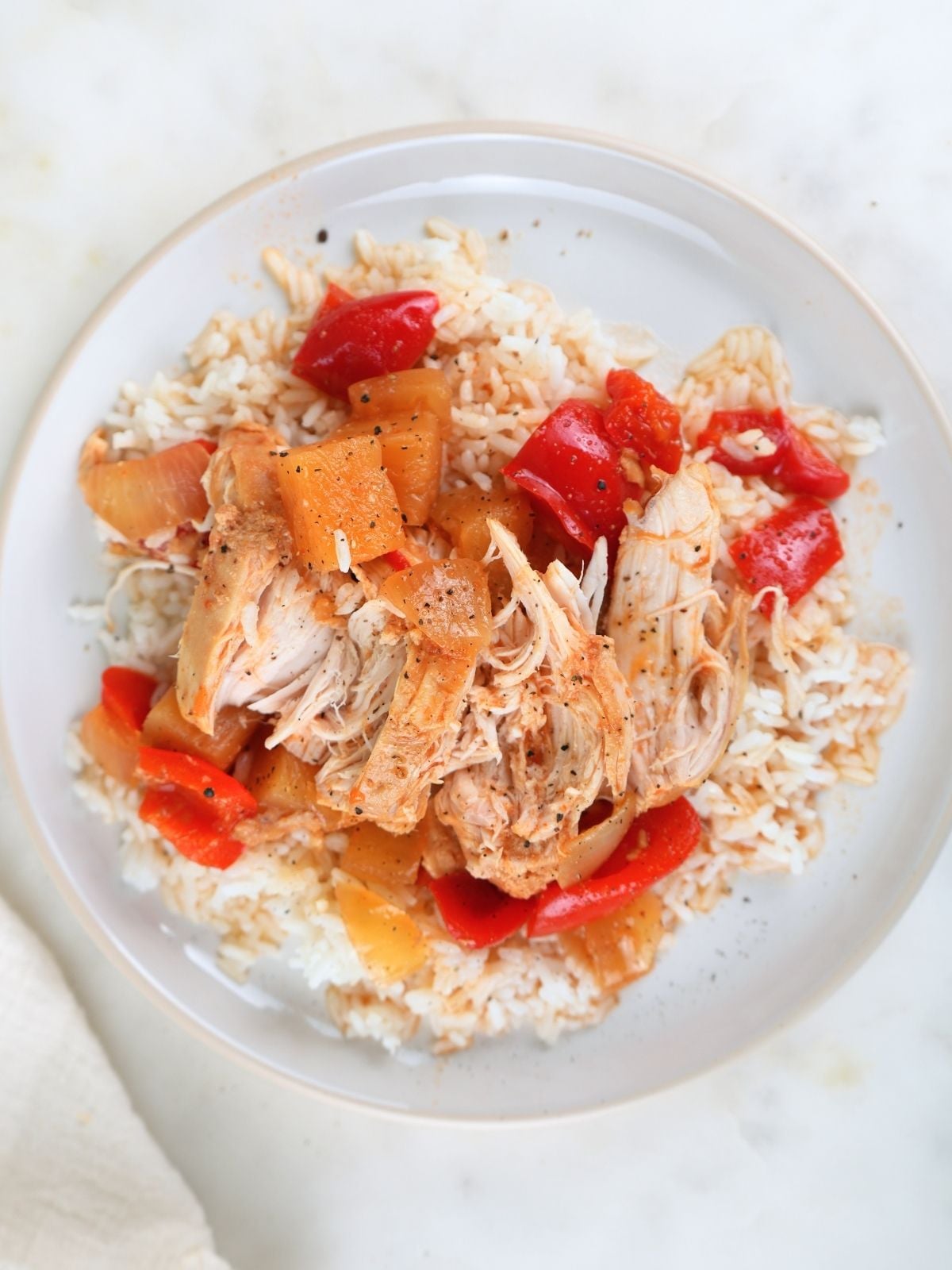 Sweet and sour chicken freezer meal served on white rice.